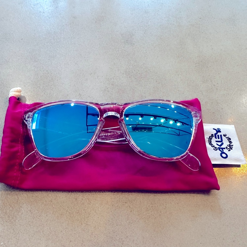 New Oakley Frogskins Transparent Frame Sunglasses with Sky Blue Lenses